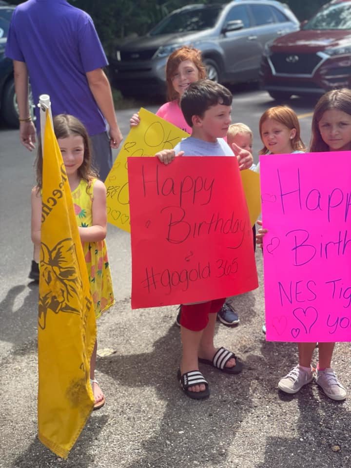 Fellow North Elementary School students participate in drive by birthday.